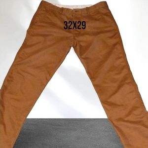 Ls pants made in Mexico the size is a 32x29 they are a darker orange color.